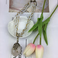 Western Retro Bohemian Ethnic Teardrop Cutout Flower Pendant Necklace Fashionable Personality Woven Sweater Chain